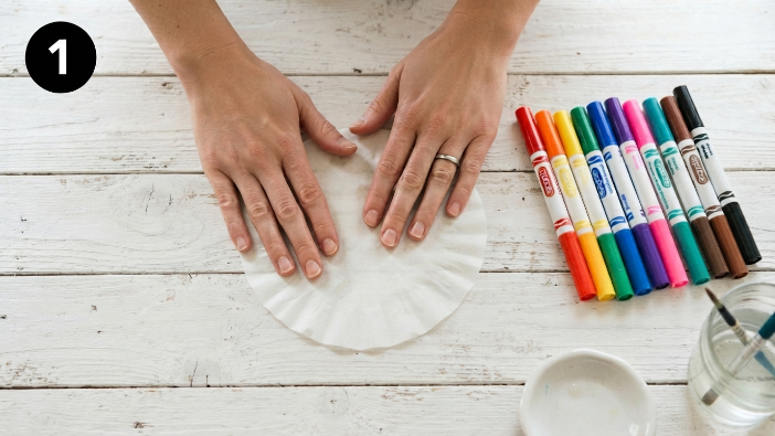 Hands smoothing coffee filter